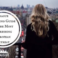 Blonde girl standing on balcony watching the streets of Prague